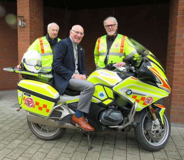 Left to right: Alan Brickwood, Warwick Rotary President Keith Talbot on WSBB’s BMW 1250RT bike and Martin Williams. Photo supplied
