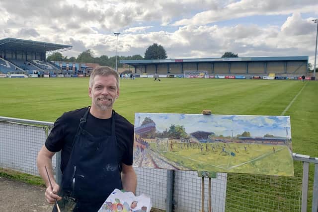 Rugby Town's opening league game of the season at Butlin Road will never be forgotten after artist Andy Brown captured the scene to add to his remarkable collection of stadium paintings.