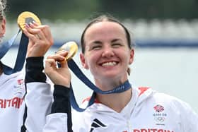 Lauren Henry celebrates gold. (Photo by BERTRAND GUAY/AFP via Getty Images)