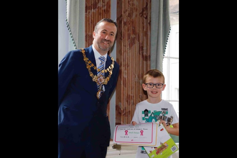 The Mayor of Warwick, Councillor Oliver Jacques, presenting the four to seven year award to Jackson Pascoe. Photo supplied
