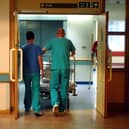 Orderlies push a bed at the Royal Orthopaedic Hospital, Oswestry.