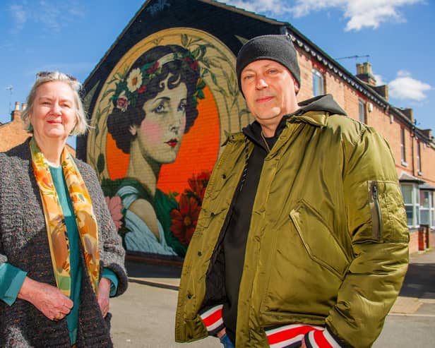 The Lady of Shrubland Street mural has been created on a gable end wall of a house in Shrubland Street.Pictured: Tim Robotham, the designer, and Dianne Page of Art Friends Warwickshire.Credit: Mike Baker