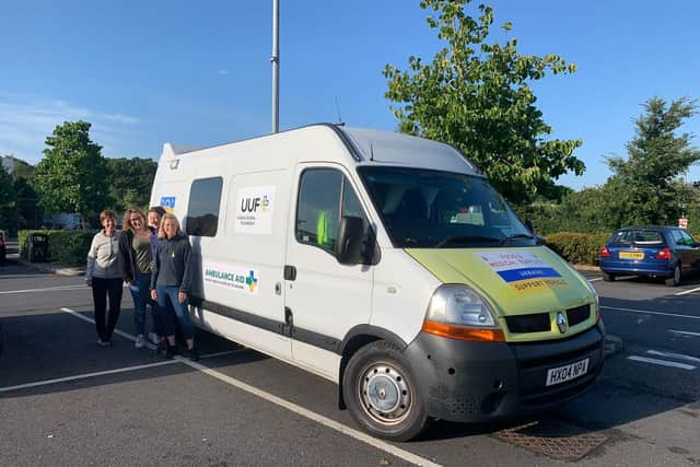 A former NHS ambulance purchased by Ambulance Aid and an SUV donated by IM Group were delivered to the Polish Ukraine border this week by four volunteers . Photo supplied