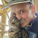 John Lancaster with one of his beloved rescue cats.