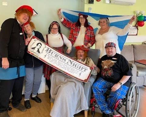 Brandon House residents and colleagues dressed in traditional Scottish clothing