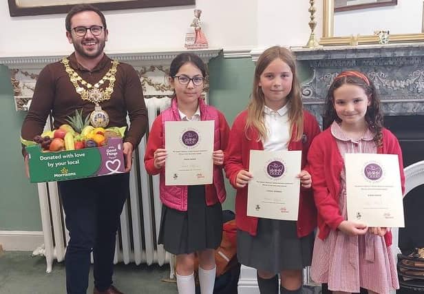 ‘The Crowns of Coten End’ from Coten End Primary School receiving their prize from the Mayor of Warwick, Cllr Richard Edgington. They were joint winners were Ella Border from Aylesford School in the five to nine age category. Photo supplied