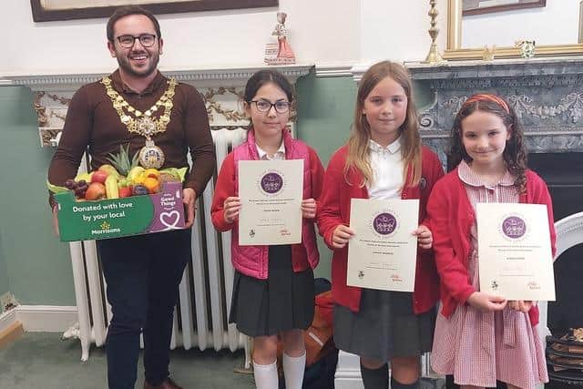 ‘The Crowns of Coten End’ from Coten End Primary School receiving their prize from the Mayor of Warwick, Cllr Richard Edgington. They were joint winners were Ella Border from Aylesford School in the five to nine age category. Photo supplied