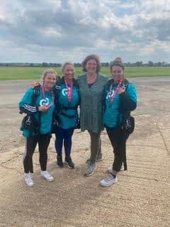Fred's mother Louise with the skydiving friends.