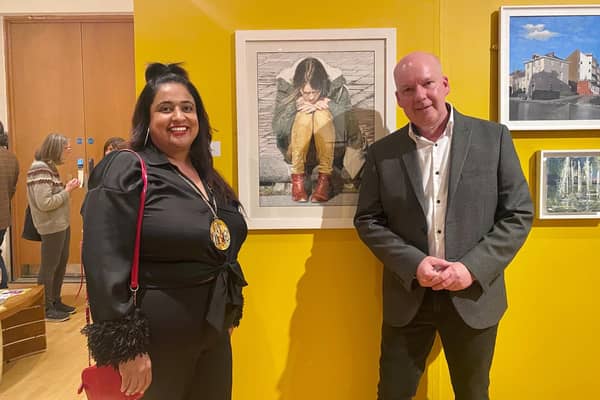 Mark Elsmore, the artist who created the winning entry Playlist' - Watercolour Gouache for The Open 2022 exhibition at Leamington Art Gallery and Museum. He is pictured with Warwick District Council chairwoman Cllr Mini Mangat who presented him with the prize of £1,000. Picture supplied.