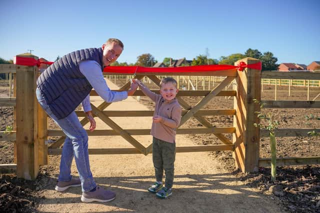 Gareth and his son cut the ribbon.