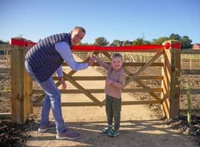 Gareth and his son cut the ribbon.