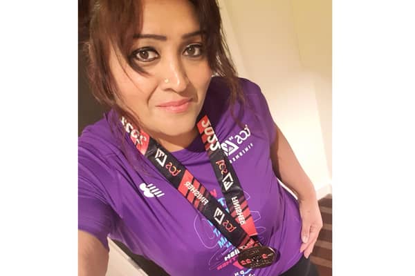 Satvir Sembhi with her medal for finishing the London Marathon 2022. Picture supplied.