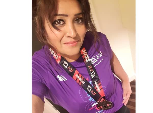 Satvir Sembhi with her medal for finishing the London Marathon 2022. Picture supplied.