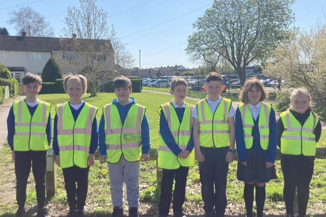 Children get ready to work on parking issues.