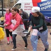 The race is on! A library picture of the pancake races in Rugby.