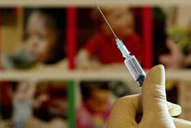 File photo dated 10/08/24 of a nurse handling a syringe at a medical centre in Ashford, Kent. Millions of parents in England are being urged to book their children in for missed measles, mumps, and rubella (MMR) jabs, amid a "very real risk" of measles outbreaks across the country. Officials said the decline in the uptake of routine childhood vaccinations is a "serious concern". Issue date: Monday January 22, 2024.