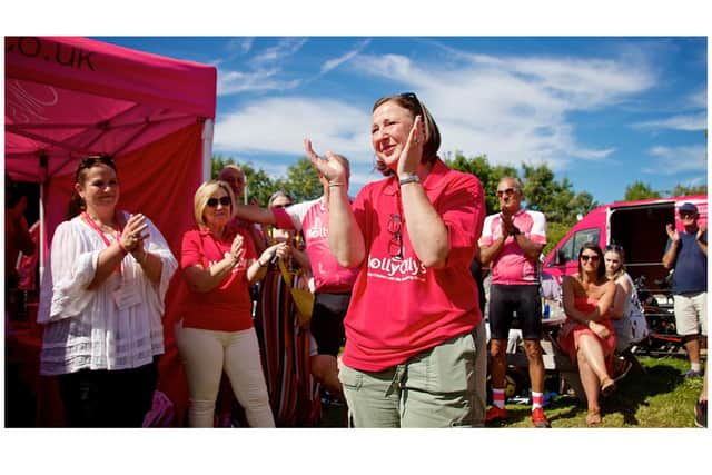 Rachel Ollerenshaw welcoming the riders at the finish line. Photo by Dave Fawbert