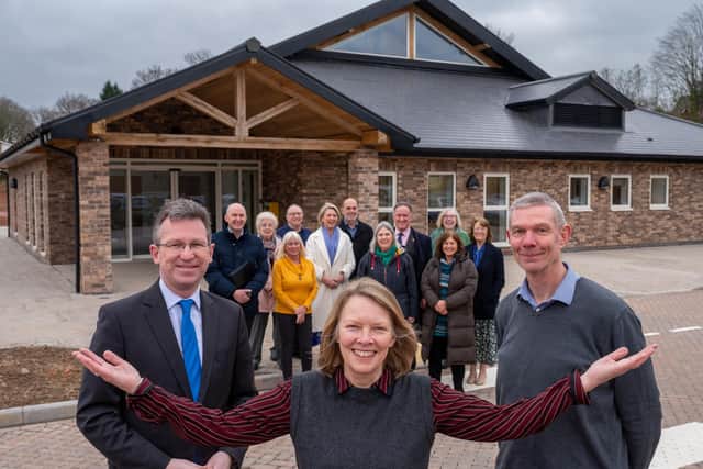Jeremy Wright MP, Cheryl Wall Burton Green Village Hall Chair, and HS2 Senior Project Manager Alan Payne pictured with trust members in front of the new facility. Picture courtesy of HS2 Ltd.