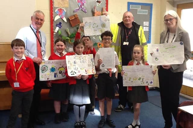 Ward Cllr Burrow, Site Manager Mr McNally and Ward Cllr Delaney with school pupils.