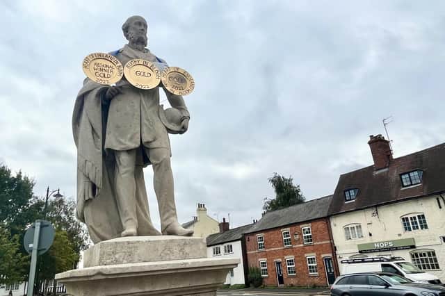 Having recently and respectfully worn a black armband for the Queen, Dunchurch's famous statue of Lord John Douglas Montagu Douglas Scott is now proclaiming the success of the village's Friends society in this year's Bloom awards.