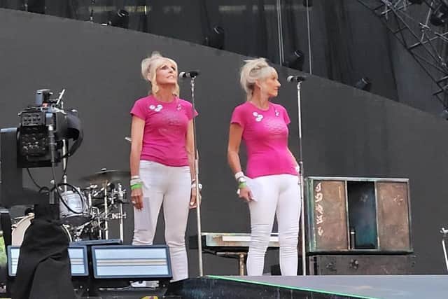 Barbara Graham and her sister Janette Fairclough take to the stage in front of 90,000 people to announce Coldplay at the band's recent concert at Wembley Stadium. Picture supplied.