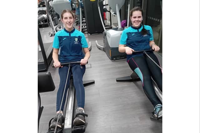 Charlotte Foss and Grace Lessard on their rowing machines. Photo supplied