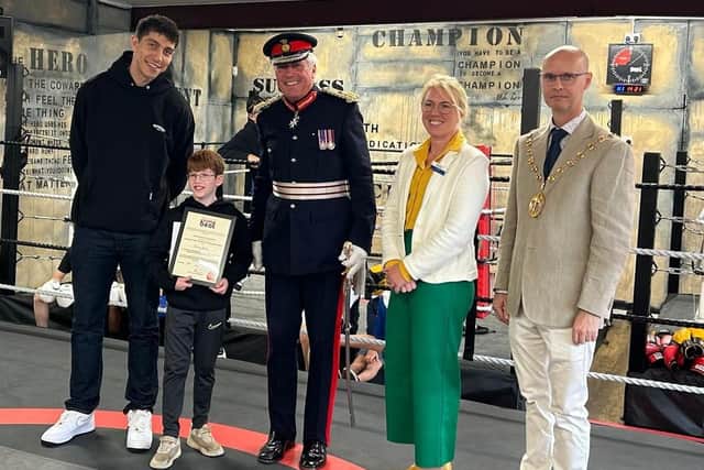 Charlie Canavan receives his award from Lord Lt Tim Co, Warwickshire Deputy Police & Crime Commissioner Emma Daniell, WDC leader Cllr Rob Margrave & Lewis Williams.