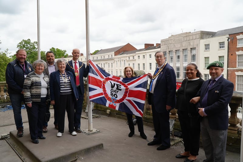 Charlie Sabin (Warwick District Council 'WDC'), Cllr Pam Redford (Armed Forces Covenant Champion, WDC), Naveen Tangri (Vice Chair, WDC), Pat Edgington (Royal British Legion), Cllr Robert Margrave (Chairman, WDC), Cllr Judith Clarke (Mayor, Royal Leamington Spa), Barry Franklin (Mayor, Whitnash), Bernadette Allen (WDC), Phil Deakin (Armed Forces Covenant Officer, WCC). Picture credit: Warwick District Council.The VE Day 80th Anniversary flag at Leamington Town Hall, which was raised on Thursday morning (May 8).