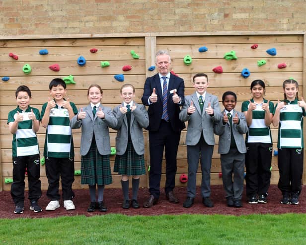 Headmaster, Joe Thackway, with pupils from Crescent School pictured by the school’s outdoor climbing wall.