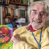 Cyril Hobbins with the first copy of his new book