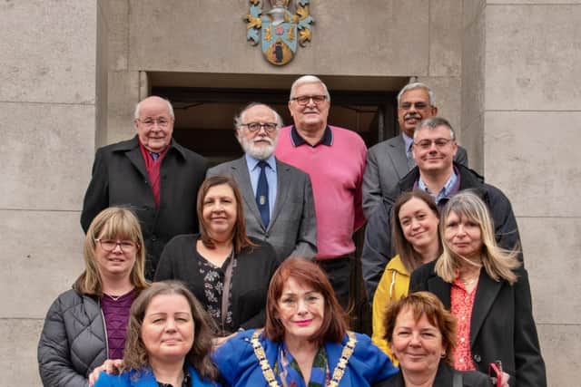 Volunteers from Rugby Autism Network, families who have been supported by the charity, with Cllr Maggie O’Rourke (front centre), Fay McSorley (front left) and Eric Wood (back left).