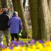 File photo dated 14/03/13 of a couple walking through a park as almost one in four people expect to work to the age of 70 or over and more than half admit they need to save more for retirement, according to a new report.