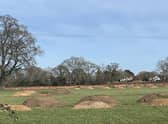The view of the earthworks from Coventry Road, Dunchurch, looking towards the houses in Cawston Lane. The mounds are easily mistaken for the actions of giant moles but are actually archaeological research in connection with the planning application for the Homestead Link Road.