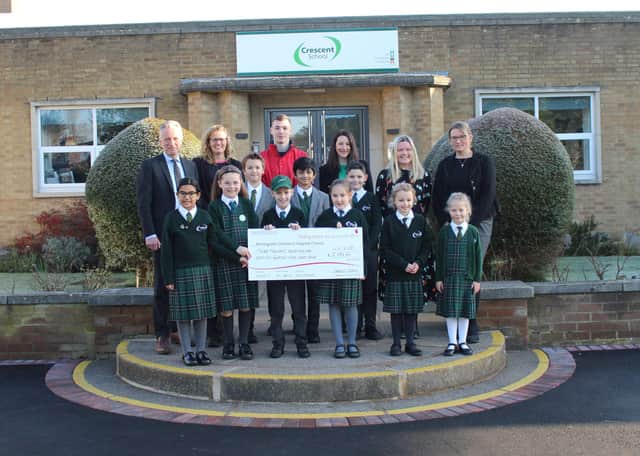 Aria Khunti, Isabella Jackson, Alex Mulhall, Barnaby Williams, Yash Patil, Beau Williams, Sam McCormick, Alexandria Woolley and Niamh Morgan and adults (left to right) – Joe Thackway (Headmaster), Amanda Yates (Teacher), Will Graves (Birmingham Children’s Hospital), Tina Williams (Parent), Laura O’Connell (Parent) and Sam Stapleton (Teacher)
