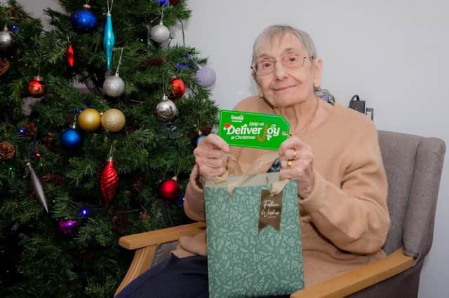 A resident with one of the gift tags