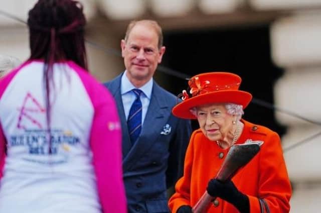 Kadeena Cox receiving the Baton from The Queen at the Queen's Baton Relay launch.