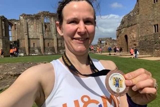 Selina Kermode with her medal for completing the Two Castles Run at the end of the race.  Picture submitted.