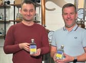 Dawid Kozlowski (left) from the Leamington Polish Centre with Dave Blick, the owner of The Warwickshire Gin Company, (right) with the Ukraine Gin.