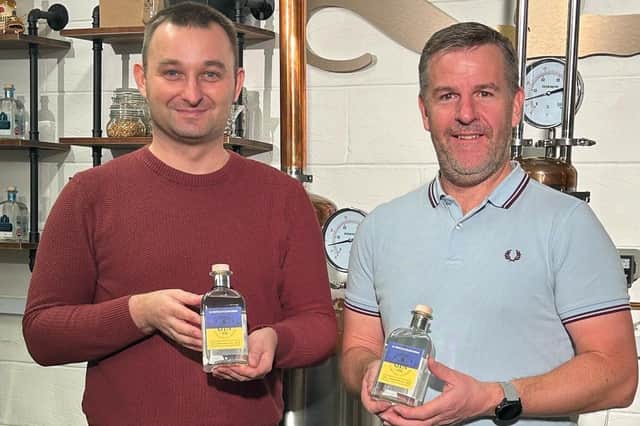 Dawid Kozlowski (left) from the Leamington Polish Centre with Dave Blick, the owner of The Warwickshire Gin Company, (right) with the Ukraine Gin.