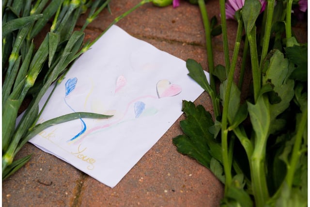 Tributes left near the civic centre in Whitnash. Photo by Mike Baker