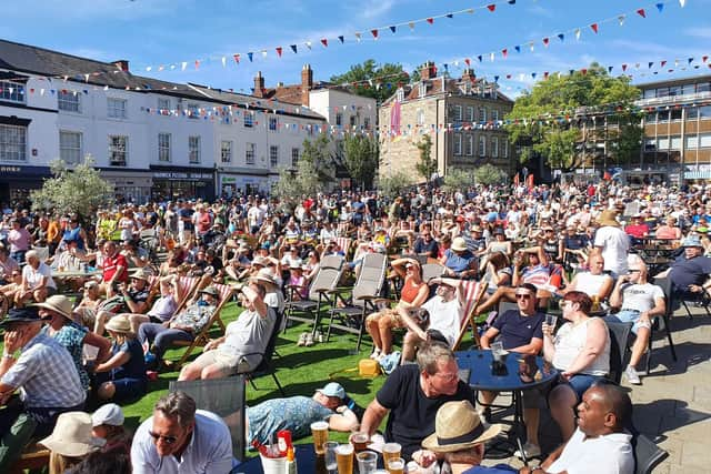 A large crowd gathered in Market Place in Warwick to watch the cycling road races on the big screen. Picture submitted.