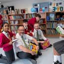 Children enjoy their new reads.