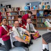 Children enjoy their new reads.