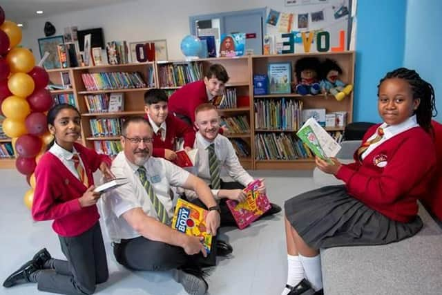 Children enjoy their new reads.