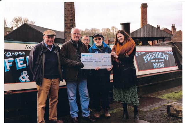 Pete Waterman at President’s mooring at the Black Country Museum in February 2020, seen presenting the Friends of President with a cheque from Braunston Marina for £20,000 to help fund President’s re-restoration. (Black Country Museum)
