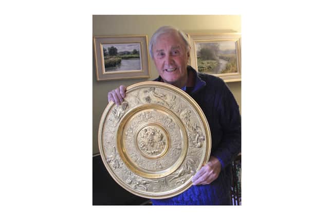 Warwick Boat Club life member Peter Bowen with The Bowen Shield, the trophy which he inherited from his father John Vincent who was a driving force behind Leamington Lawn and Tennis Club's move to its current location. Players from The Boat Club and Leamington club will compete for the trophy for the first time this coming weekend. Picture supplied.