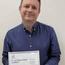 Mark Shrimpton, of Wright Hassall, with the Planet Mark certificate
