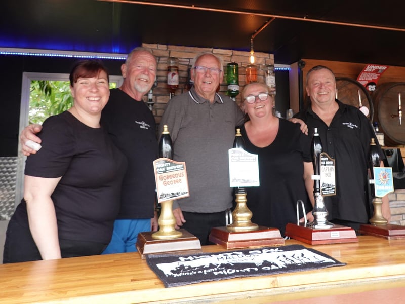 Music legend and steam enthusiast Pete Waterman pictured with the Best Bar None mobile bar team from Essex at the 2023 Rally, which Pete opened.