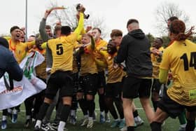 Racing Club Warwick's players celebrate a memorable promotion.