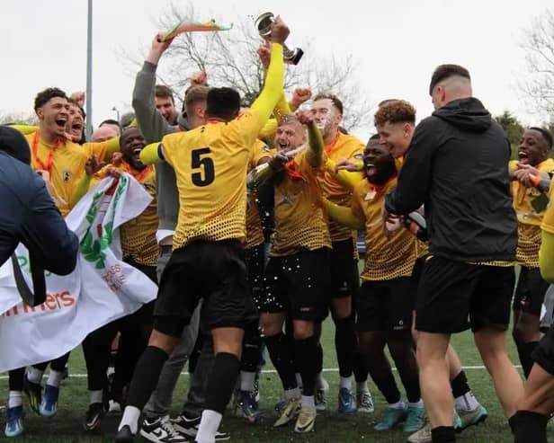 Racing Club Warwick's players celebrate a memorable promotion.